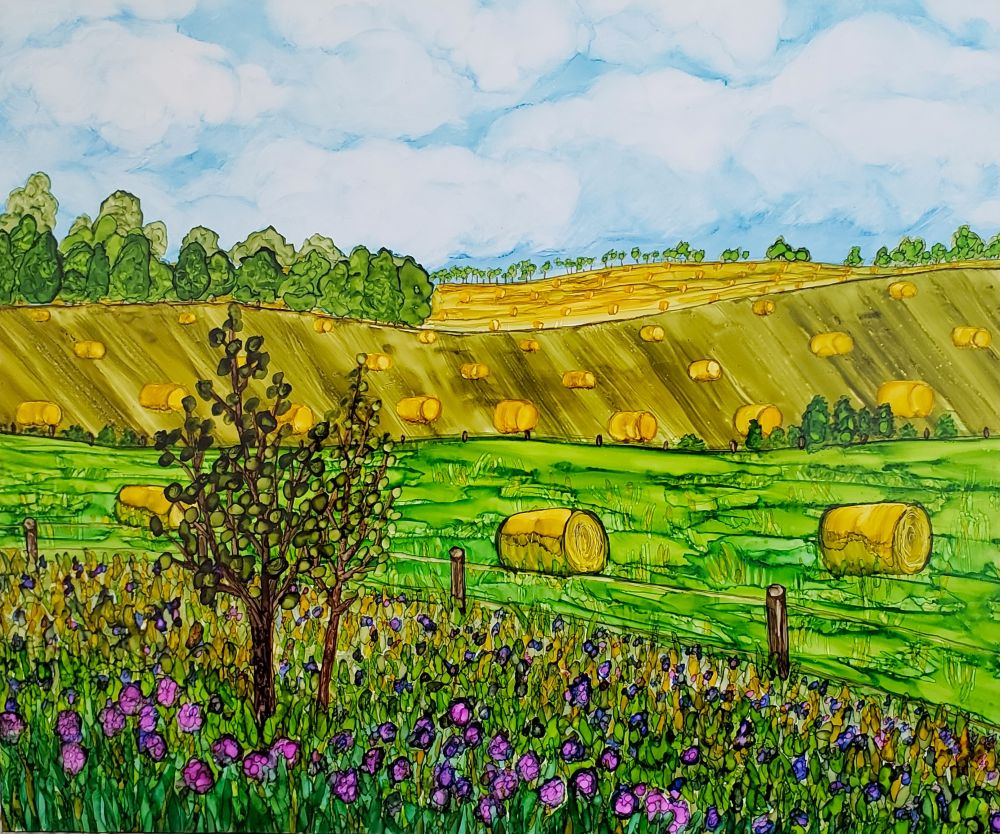 landscape of fields painted with alcohol ink