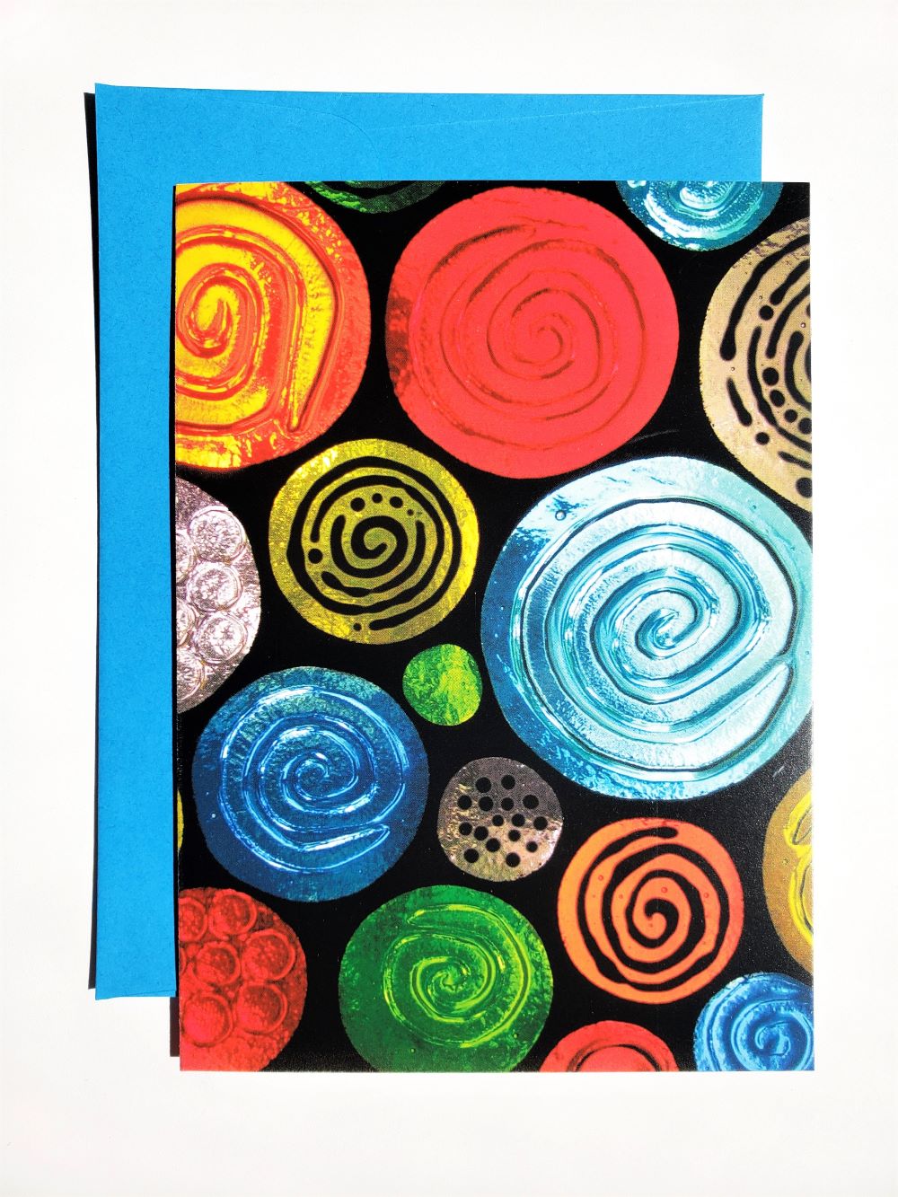 blank greeting card with art on front shown with colored envelope