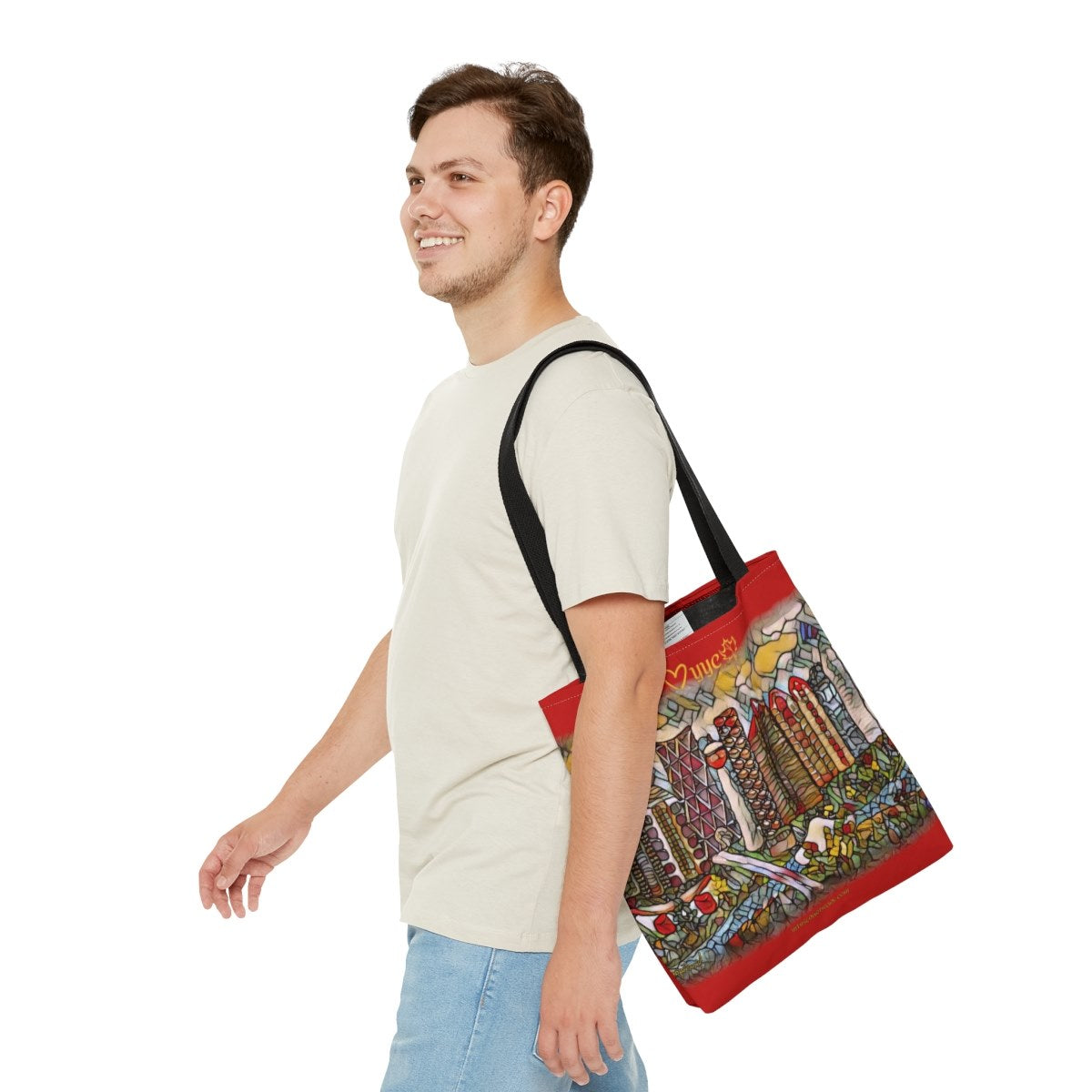 man carrying red tote bag with calgary cityscape art
