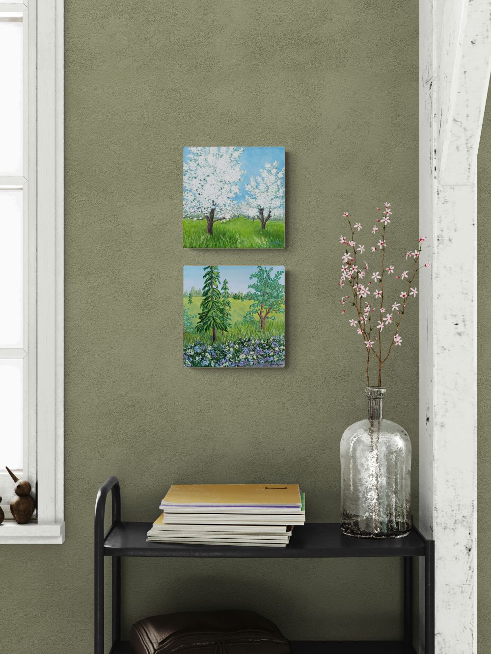 two tree paintings shown on wall decor setting