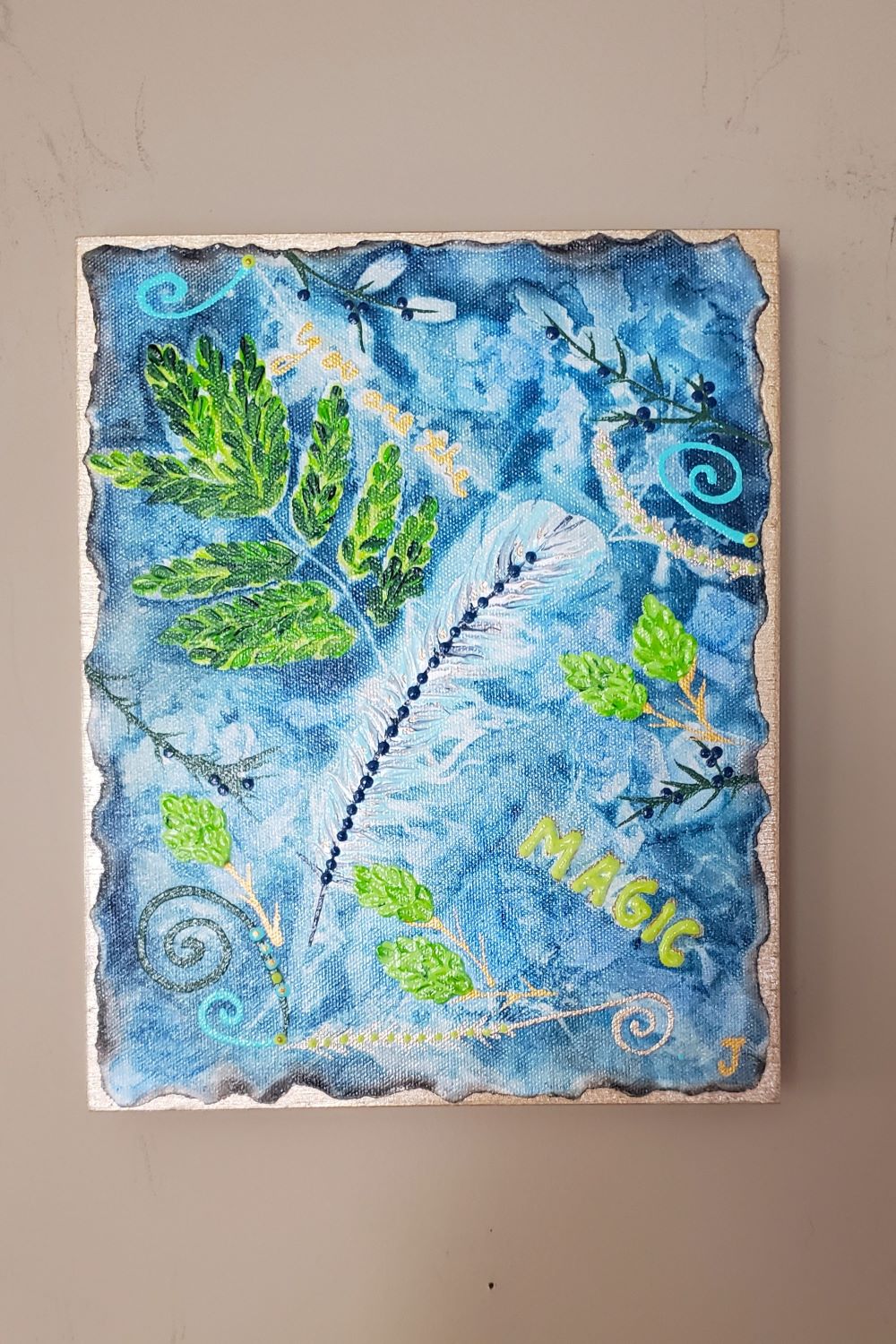 Blue green Sunprint art shown  on a taupe wall