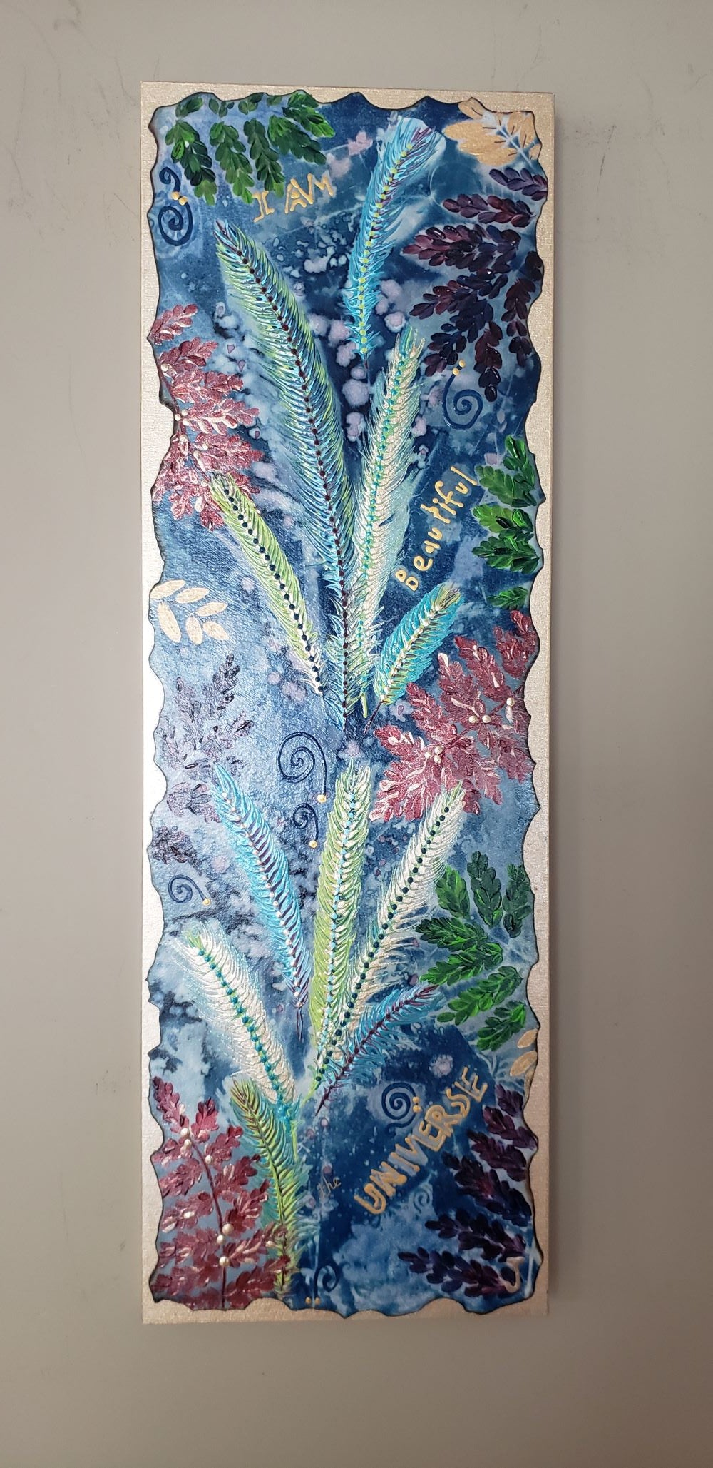 Cyanotype Sunprint painting shown on a taupe colored wall