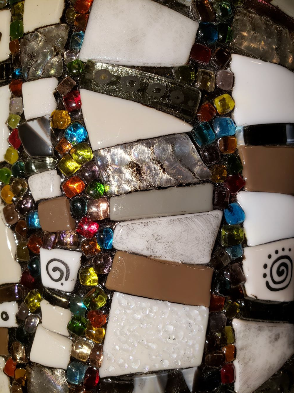 detail of glass wall art sconce called the Shagadelic Rainbow zebra