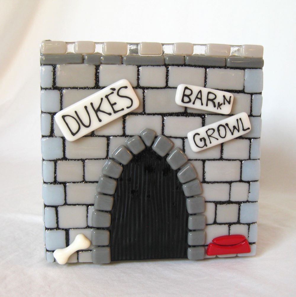 front view of custom castle urn made of glass