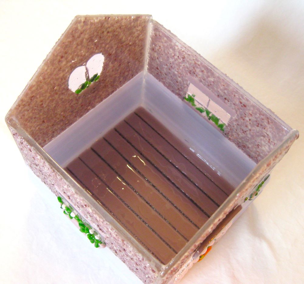 insdie view of little house urn made of fused glass