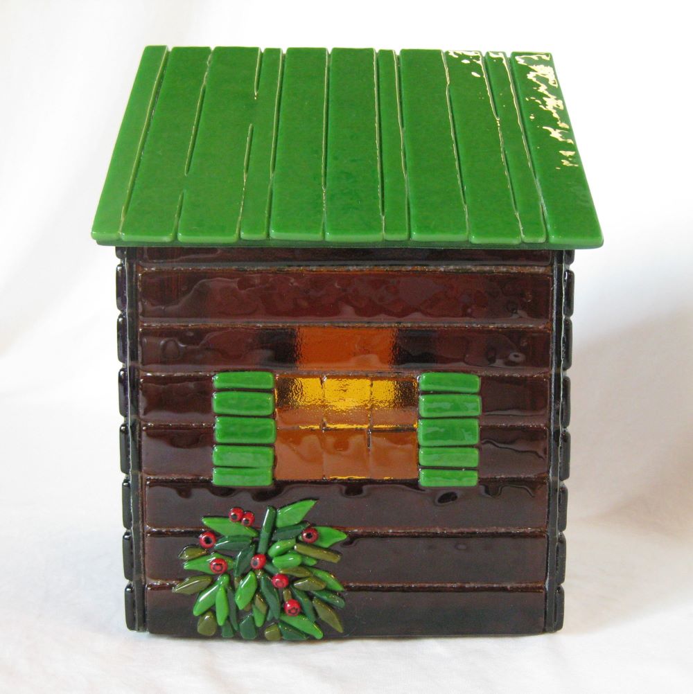 side view of custom urn shaped like a cabin