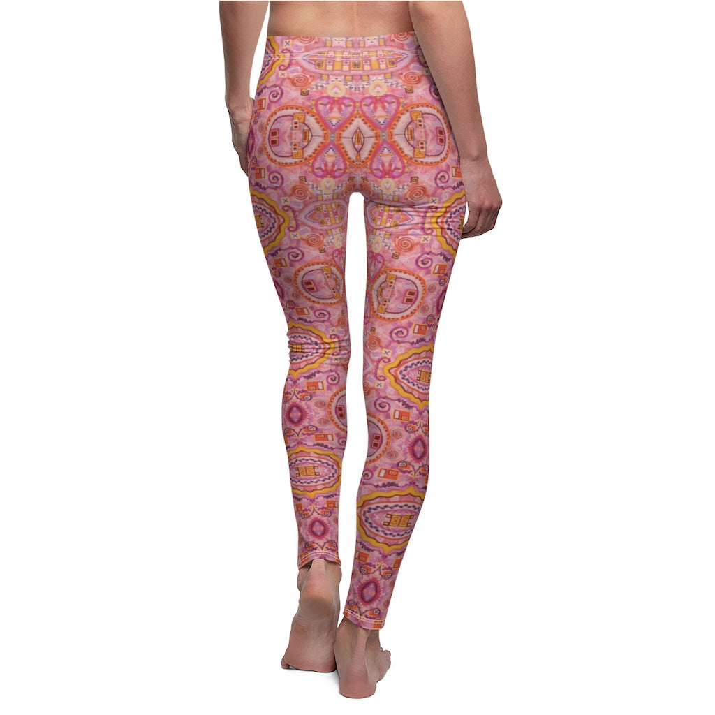 back view of pink leggings with the happiness is contagious pattern