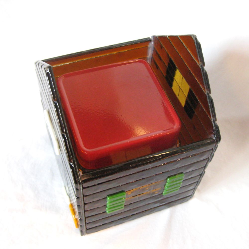 view of inside of urn to show how container of ashes fits in it