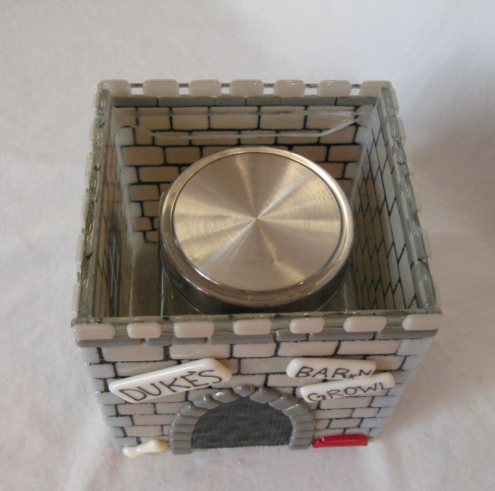 view of inner urn showing how container of ashes fits inside