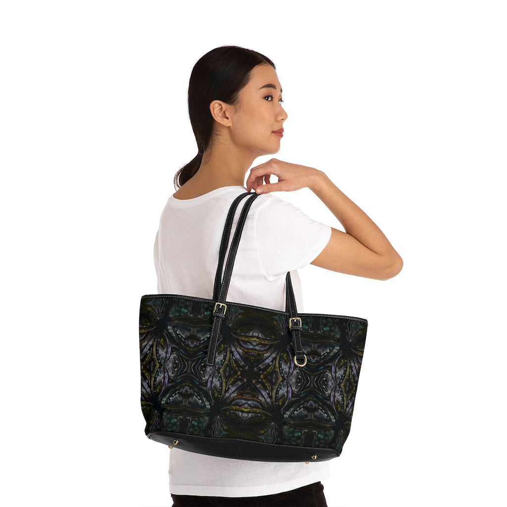 woman with larger shoulder bag slung over her shoulder