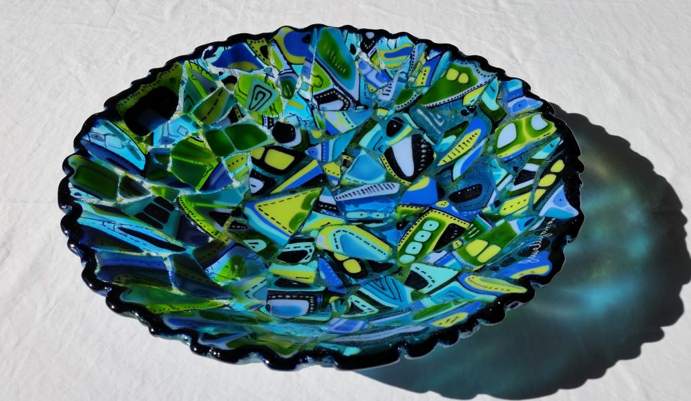 top view of blue glass art decor bowl called Inimitable blues made by artist Jeweliyana Reece