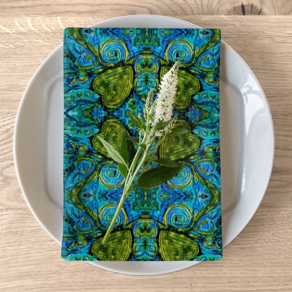 dinner napkins with a blue green heart print