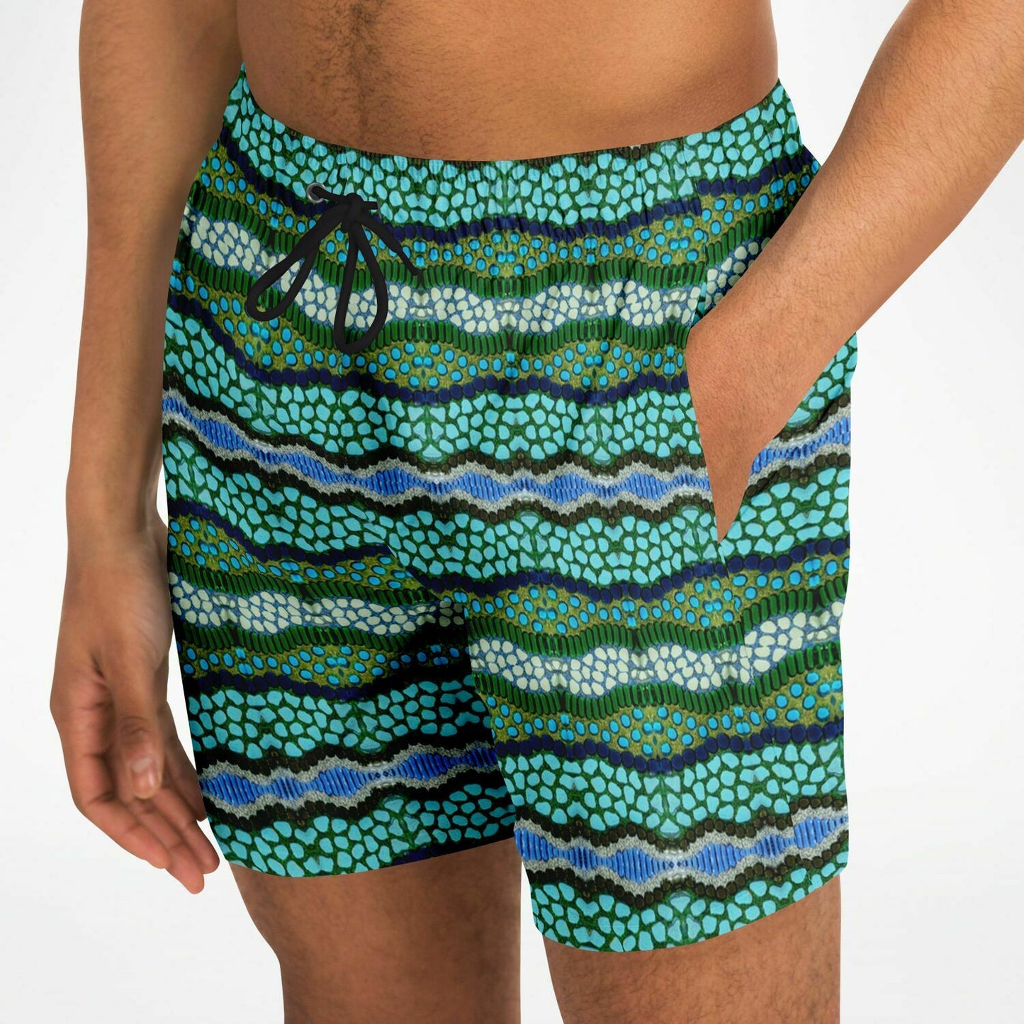 Front close up of mens swim trunks with blue lagoon pattern