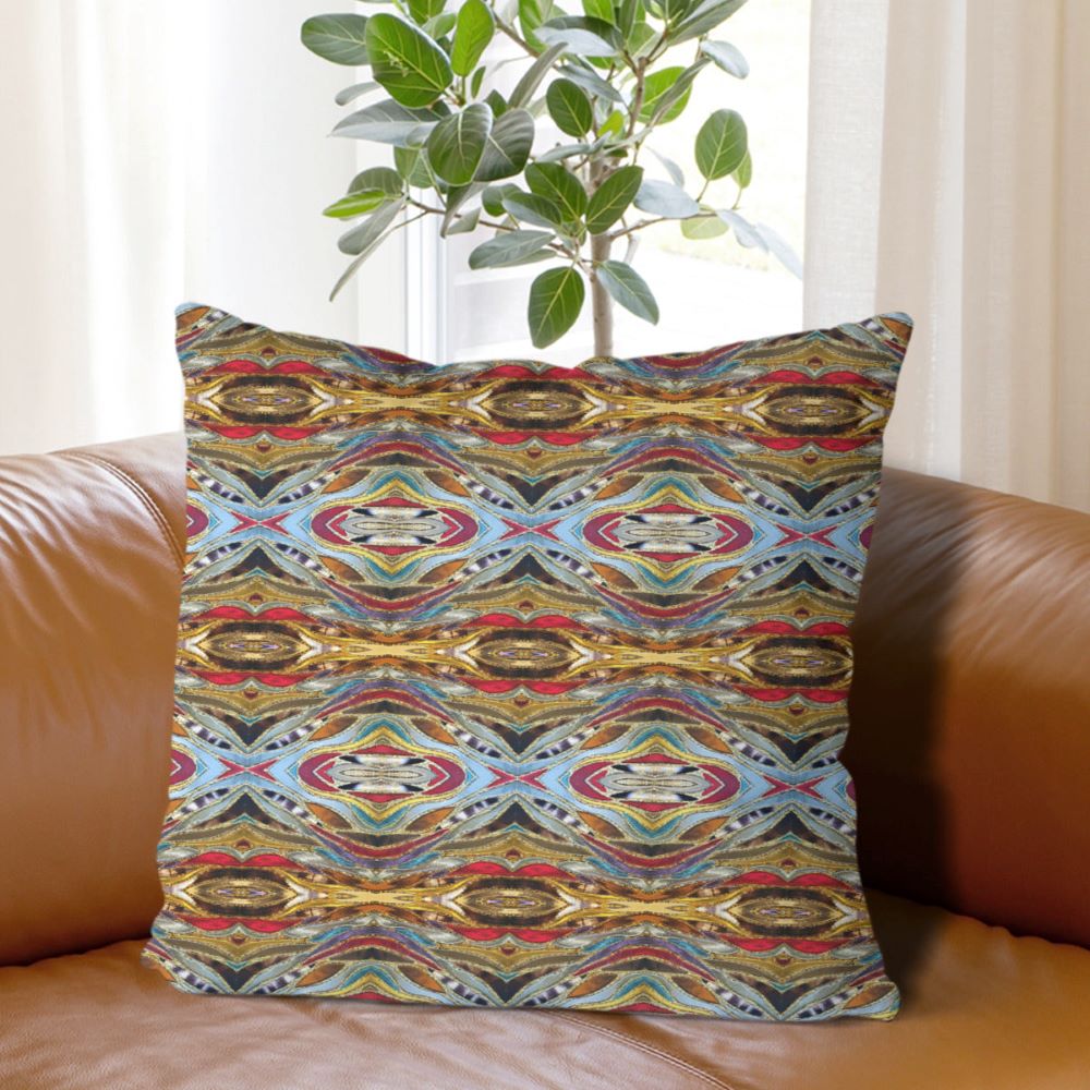 Western style decor pillow shown on couch