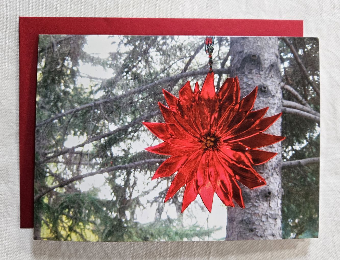 art card with a glass poinsettia suncatcher  on cover and blank inside