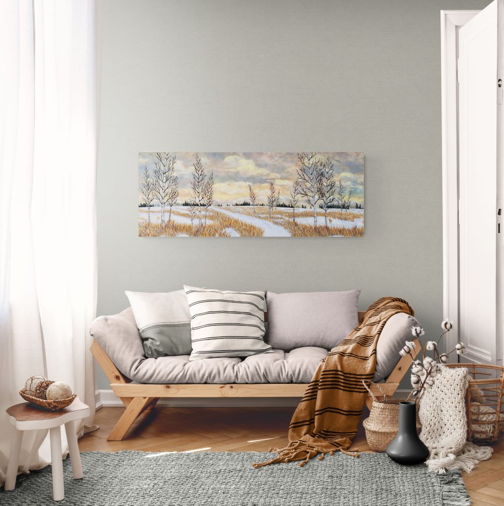 canadian lanscape painting of big sky and trees in a field in winter shown in a living room setting