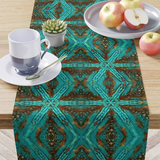 cloth dining table runner with a designer daimond pattern in aqua blue and amber