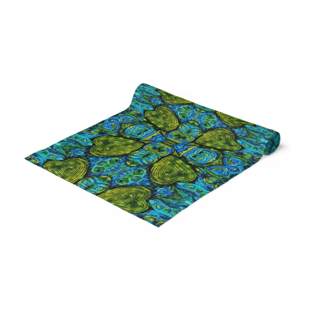 dining table runner with blue green art of hearts on it