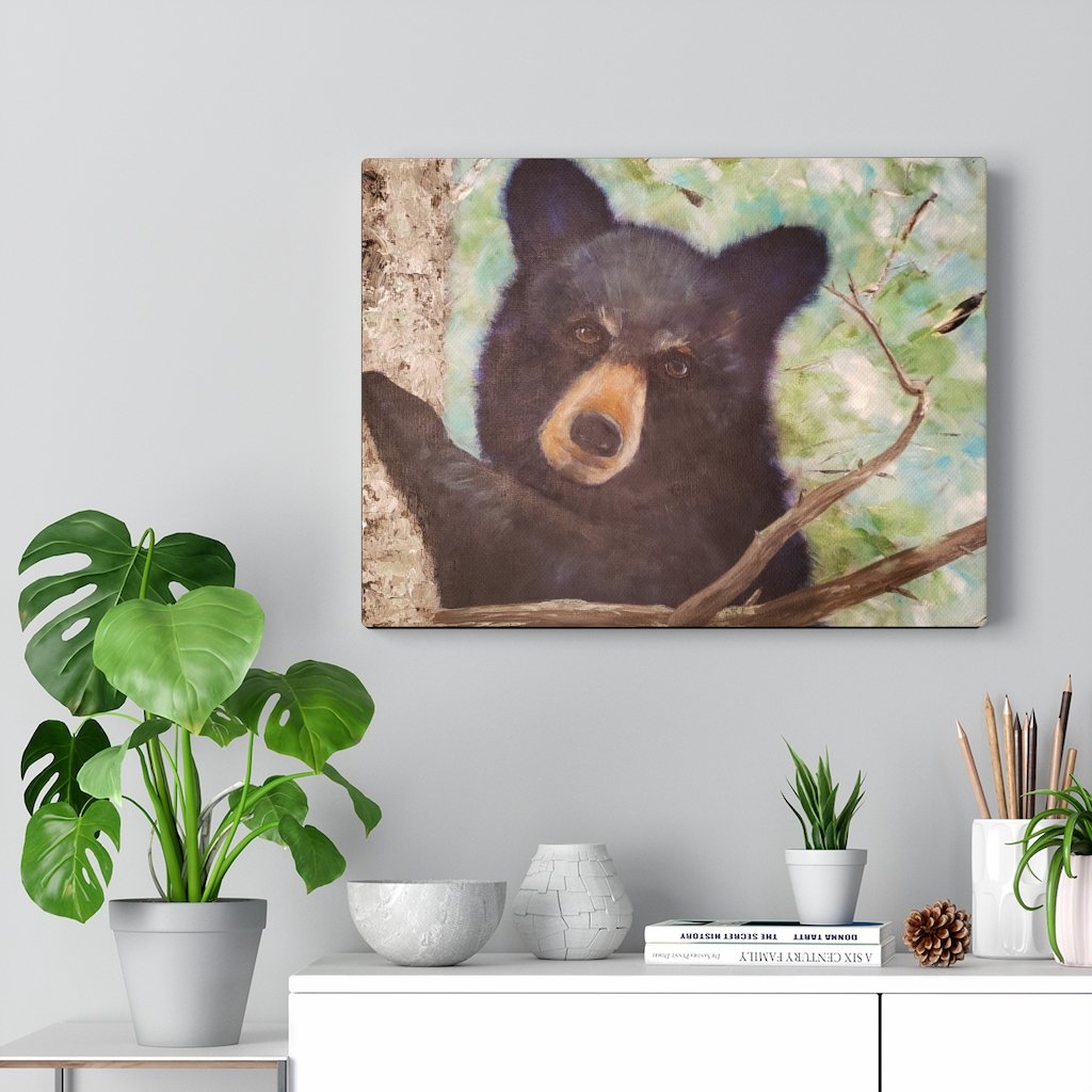 Painting of young black bear shown on wall in home decor setting 