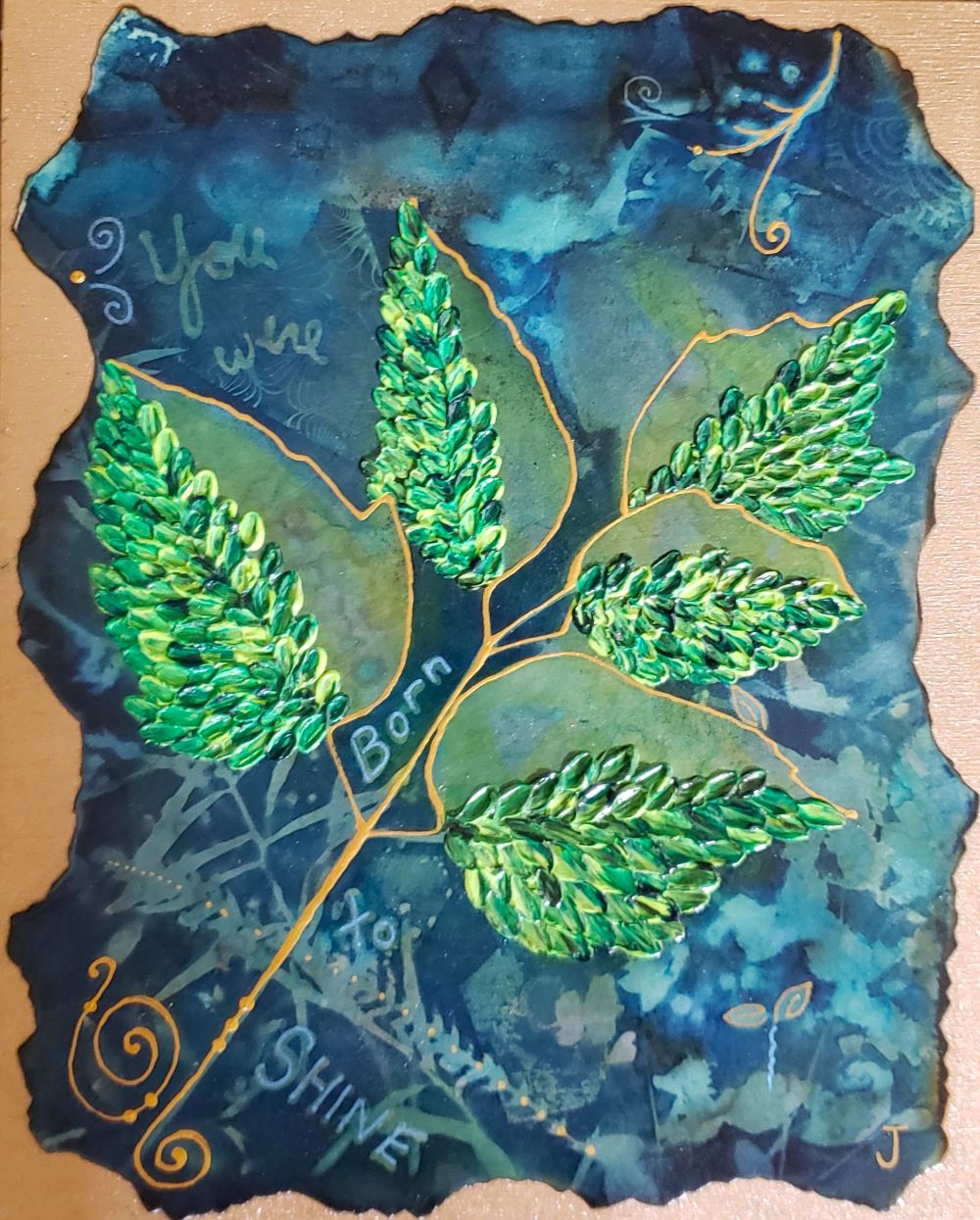 original artwork with you were born to shine written into it. Navy cyan background with green leaves mounted on gold  birch board