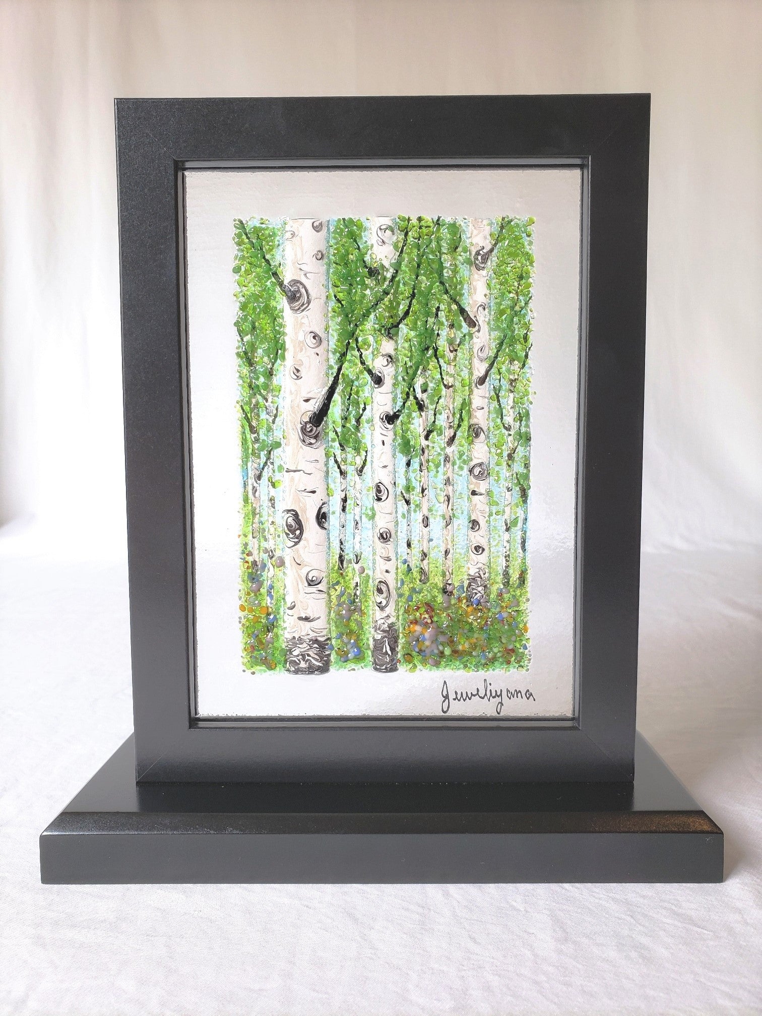 fused glass art of green summer birch trees
