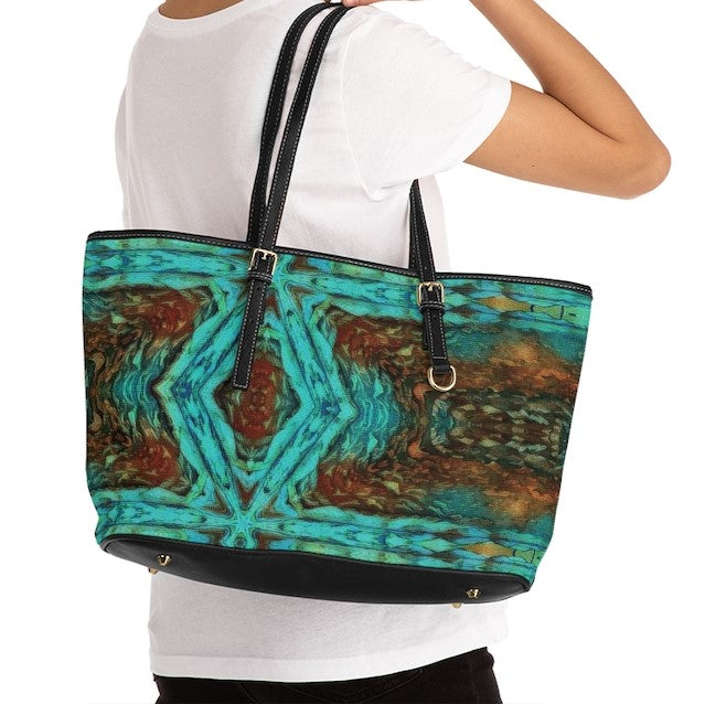Shoulder bag purse shown over arm of a woman