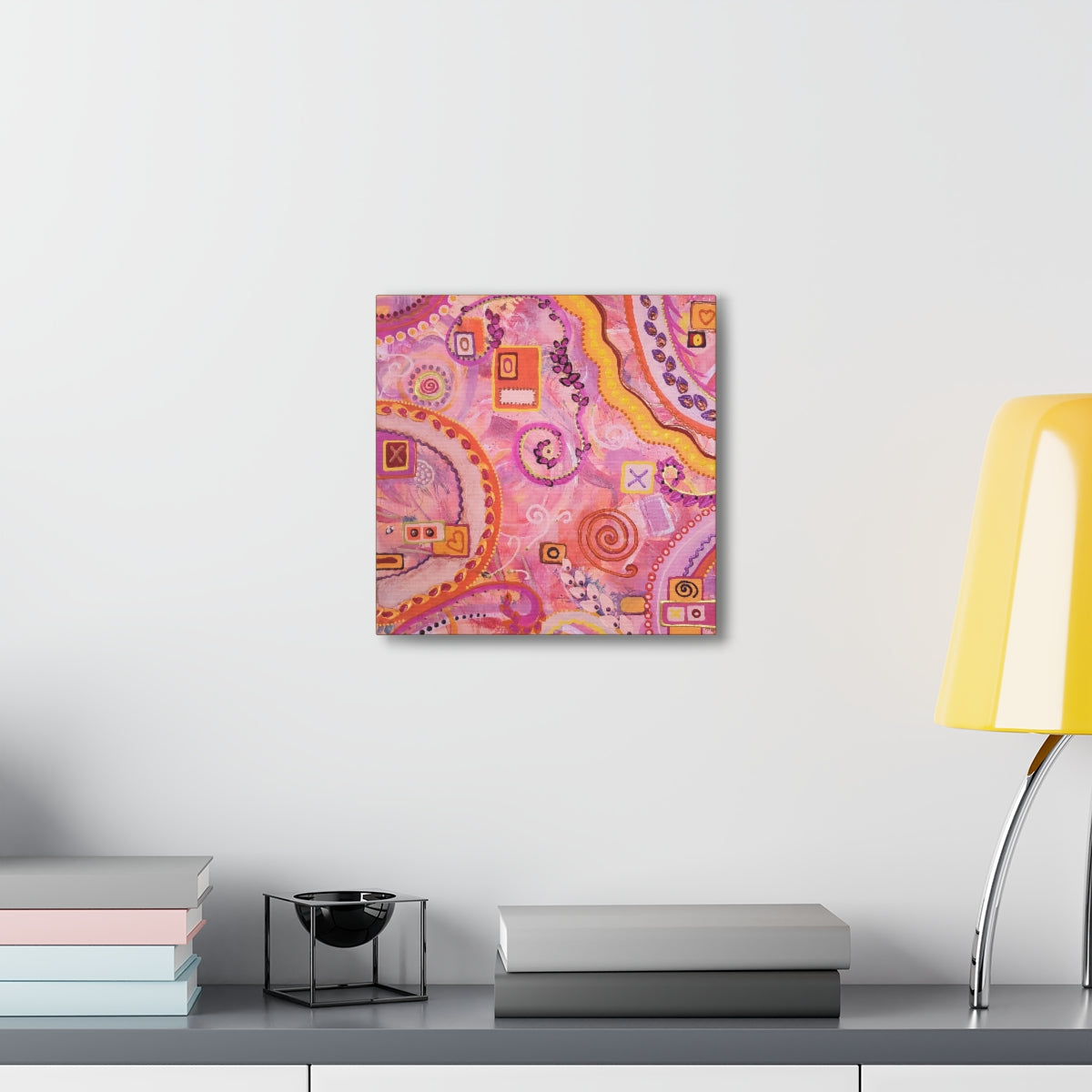 pink abstract painting shown on wall 